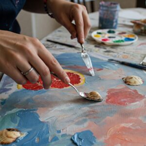 Artist experimenting with new painting techniques to break creative block