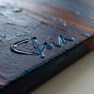 What Makes Paintings Valuable: Unveiling the Secrets Behind Art’s Worth 3 Close-up of an artist's signature on a textured oil painting, symbolizing how artist reputation is crucial for what makes paintings valuable.