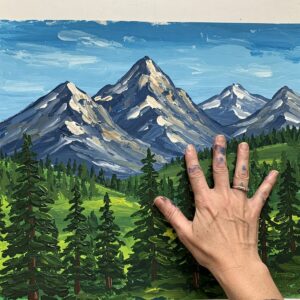 Textured landscape created using layered finger painting techniques for adults