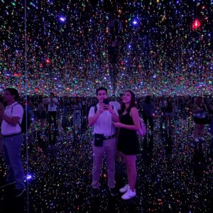 The Power of Presence: Immersive Art Audience Engagement Explained 4 Audience participating in Yayoi Kusama's Infinity Mirror Room