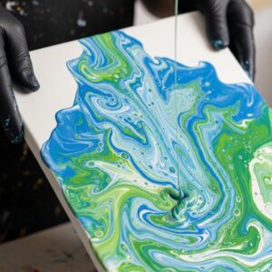 What is Pour Painting? A Fun and Easy Guide for Beginners 2 tilting canvas pour painting