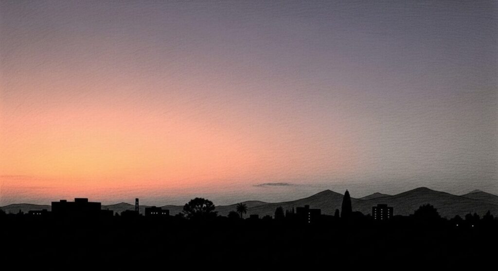 Easy drawing of a sunset with silhouetted landscape.