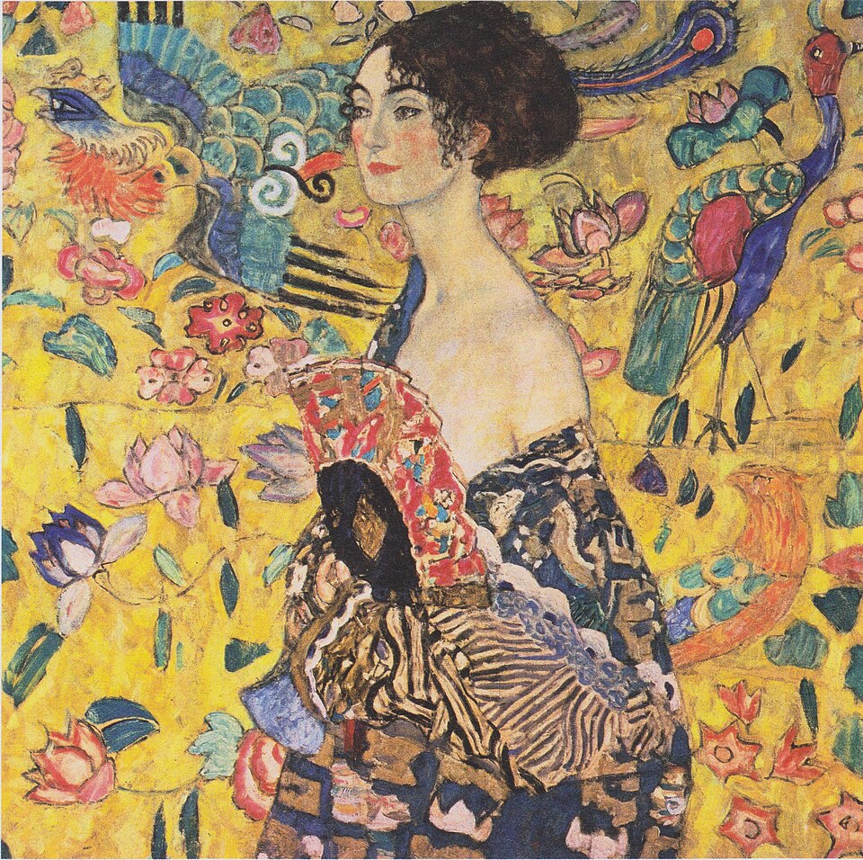 Golden Masterpieces: Discover the Top 10 Gustav Klimt Paintings 11 "The Lady with a Fan" by Gustav Klimt, painted in 1918. Description: This was the last portrait Klimt was working on when he died, found on an easel in his studio. It shows an unidentified woman holding a fan, her shoulder elegantly exposed. Unlike his golden portraits, this piece is full of vibrant color and is heavily influenced by Chinese and Japanese art, visible in the background motifs of a phoenix and lotus blossoms. The painting feels spontaneous and full of life, a final burst of creative energy.. Interesting fact: Because the painting was still in his studio upon his death, it offers a rare glimpse into his unfiltered artistic process.