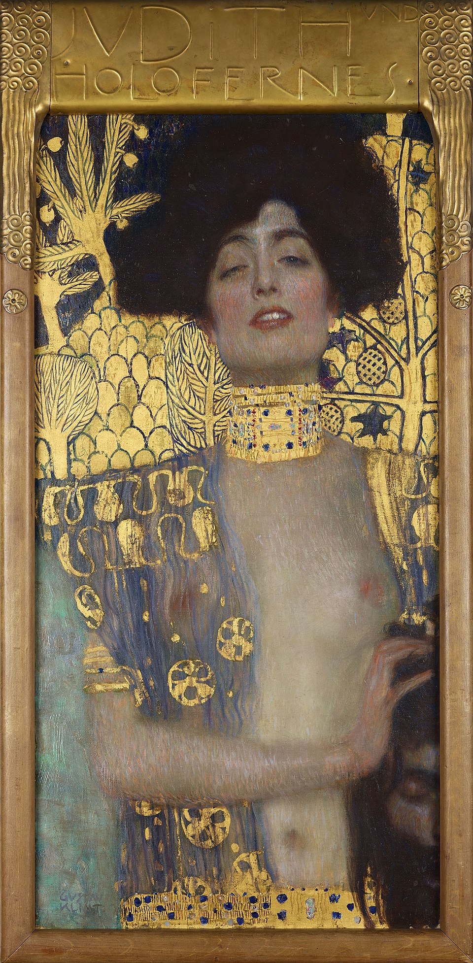 Golden Masterpieces: Discover the Top 10 Gustav Klimt Paintings 7 "Judith and the Head of Holofernes" by Gustav Klimt, painted in 1901. Description: This is not your typical historical painting. Klimt portrays the biblical hero Judith as a powerful and seductive Viennese woman of his time. With a look of defiant triumph, she holds the severed head of the general Holofernes. The rich gold background and her elaborate jewelry make her seem more like a goddess than a mere mortal. Klimt challenged tradition by focusing on Judith's power and sensuality rather than her piety.. Interesting fact: The model for Judith is believed to be the same woman from 'The Woman in Gold,' Adele Bloch-Bauer.