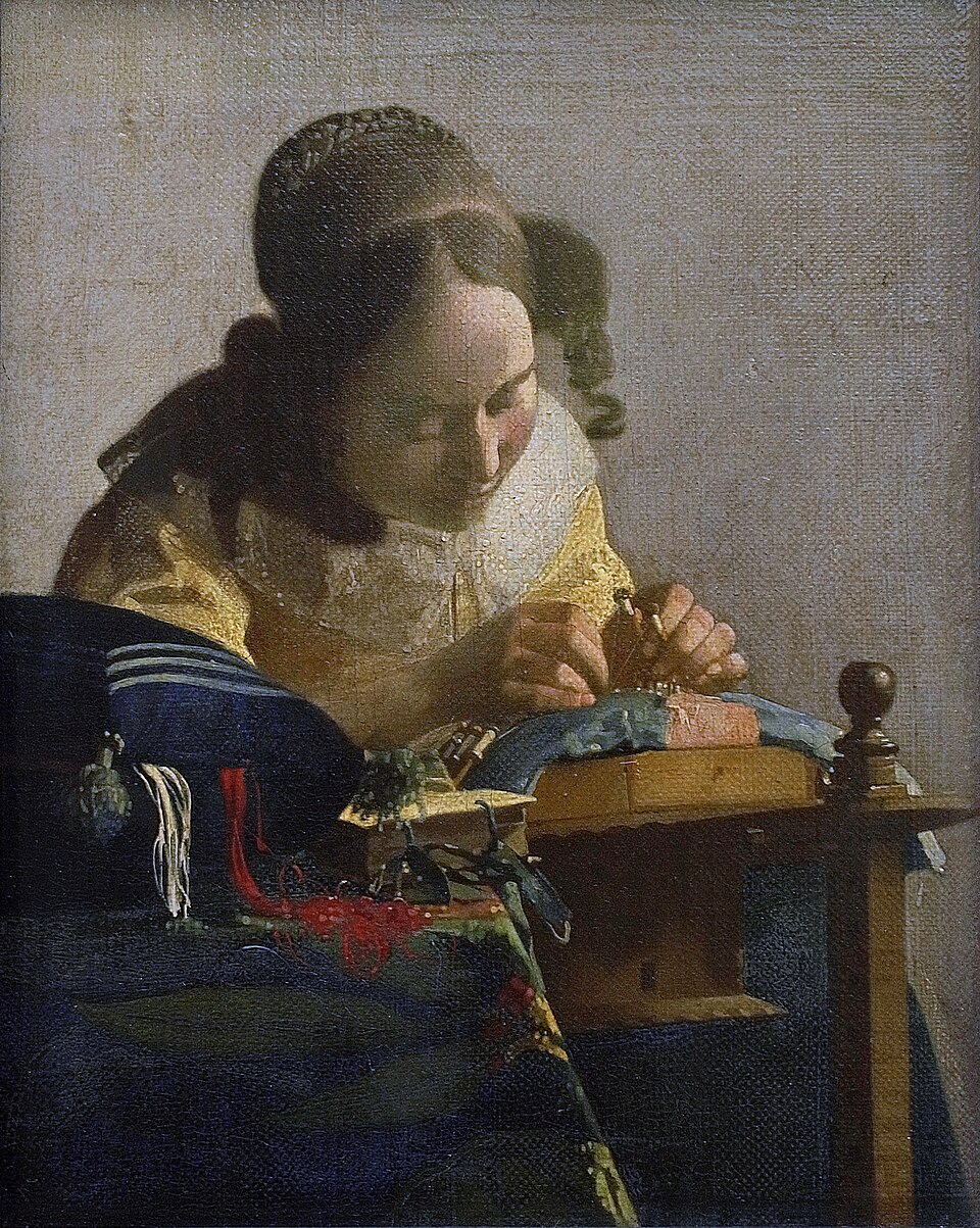 A painting by Vermeer titled The Lacemaker